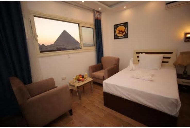 Hotel Pyramid View Gh à Kafret el-Gabal Extérieur photo